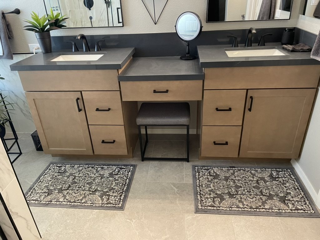 Charcoal quartz vanity tops with a full-length matching backsplash, Gilbert, AZ